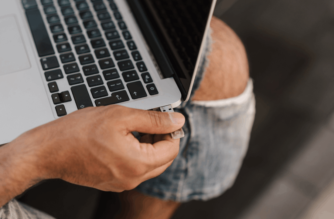 Person plugging in flash drive